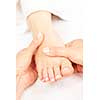 Female hands giving massage to soft bare foot