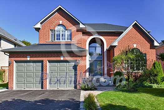 Brick house in suburbs with two car garage Brick house in suburbs with two car garage