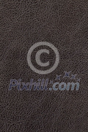 Dark brown natural leather background or texture close up Dark brown natural leather background or texture close up