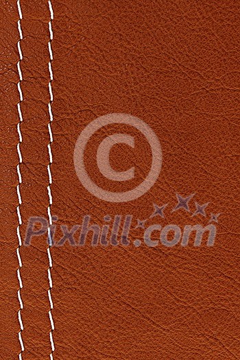 Leather background in brown with white stitches Leather background in brown with white stitches