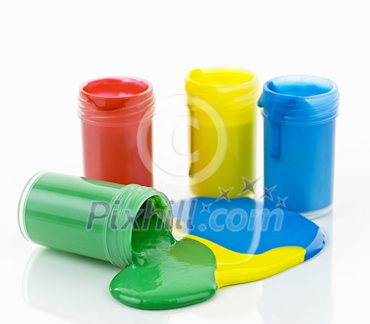 Open containers of paint in primary colors spilled and mixed Open containers of paint in primary colors spilled and mixed
