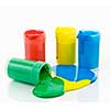 Open containers of paint in primary colors spilled and mixed