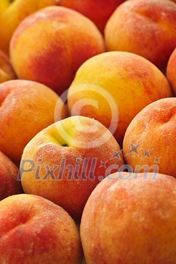 Ripe fresh peaches as background close up Ripe fresh peaches as background close up