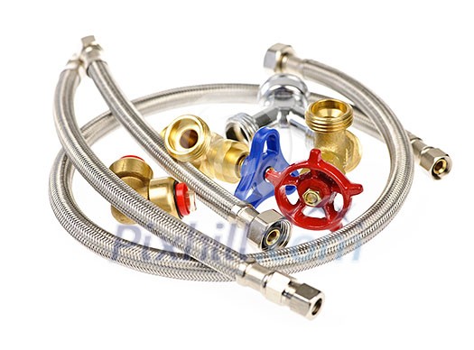 Pile of plumbing valves hoses and assorted parts isolated on white background Pile of plumbing valves hoses and assorted parts isolated on white background