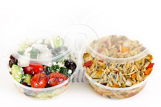 Two servings of prepared salad in plastic takeaway containers Two servings of prepared salad in plastic takeaway containers