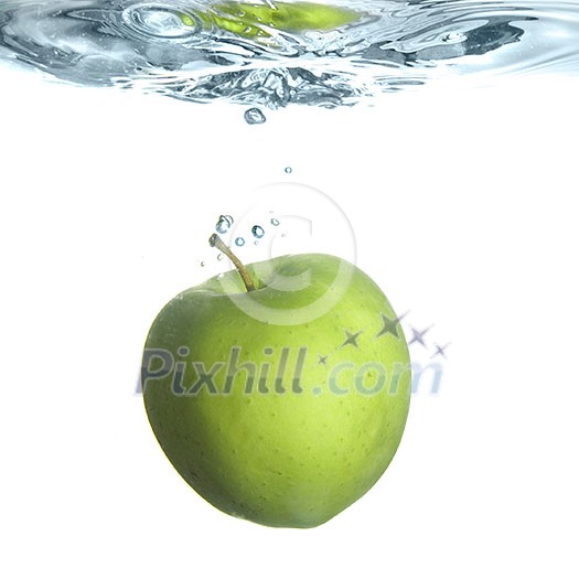green apple dropped into water with bubbles isolated on white green apple dropped into water with bubbles isolated on white