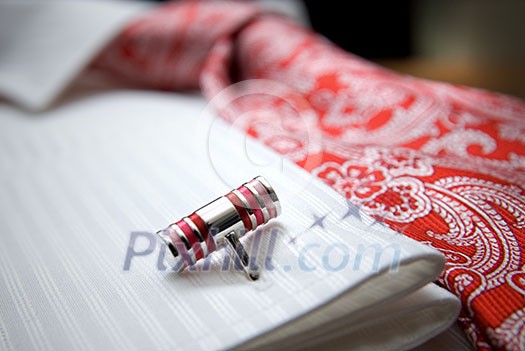 close-up photo of stud on white shirt with red tie close-up photo of stud on white shirt with red tie