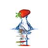 Fresh strawberry dropped into blue water with splash isolated on white
