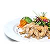 fried frogs legs on the plate isolated on white