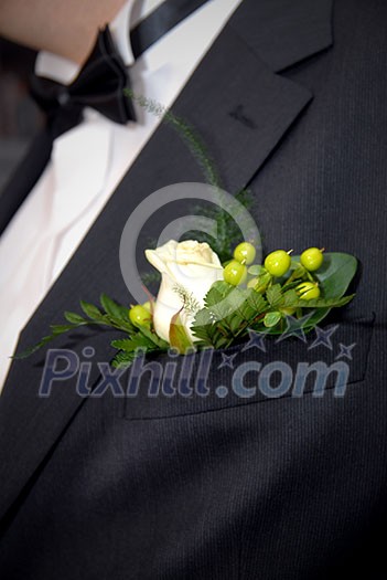 wedding buttonhole with rose on mans suite wedding buttonhole with rose on mans suite