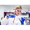 Portrait of a female researcher carrying out research in a chemistry lab (color toned image; shallow DOF)