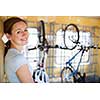 Cycling tourism: young woman traveling by train with her bike