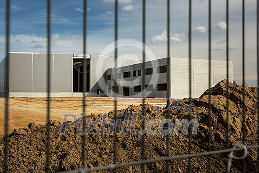 Construction site with a fence around it Construction site with a fence around it