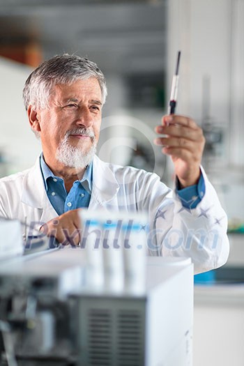 Senior chemistry professor/doctor in a lab (color toned image) Senior chemistry professor/doctor in a lab (color toned image)
