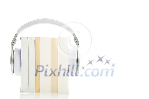 Audiobook concept - listen to your books in HD quality; hi-end hifi headphones over multiple books on white Audiobook concept - listen to your books in HD quality; hi-end hifi headphones over multiple books on white