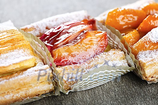 Closeup on slices of flaky fruit strudel desserts Closeup on slices of flaky fruit strudel desserts