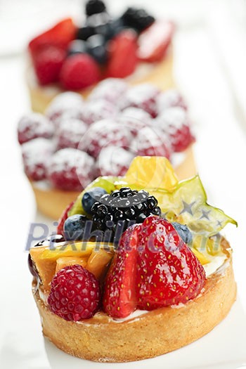 Closeup of fancy gourmet fresh fruit dessert tarts Closeup of fancy gourmet fresh fruit dessert tarts