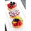 Closeup of fancy gourmet fresh fruit dessert tarts