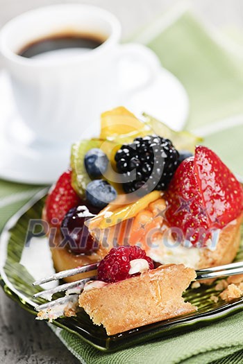 Fresh mixed berry tart served with coffee for dessert Fresh mixed berry tart served with coffee for dessert