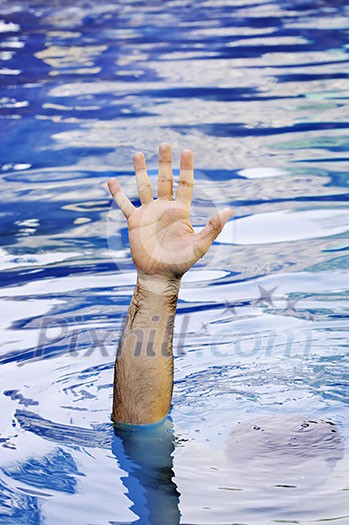 Hand of drowning man needing help and assistance Hand of drowning man needing help and assistance