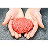 Chef making hamburger patty in kitchen with ground beef