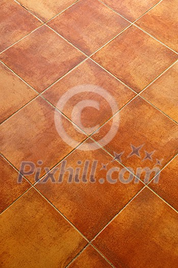 Closeup of square terracotta ceramic tile floor background Closeup of square terracotta ceramic tile floor background