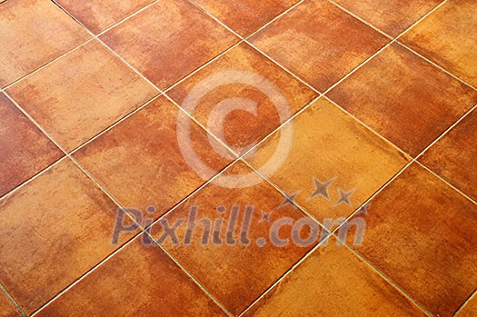 Closeup of square terracotta ceramic tile floor background Closeup of square terracotta ceramic tile floor background