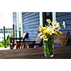 Bouquet of wildflowers on a rustic table at country cottage