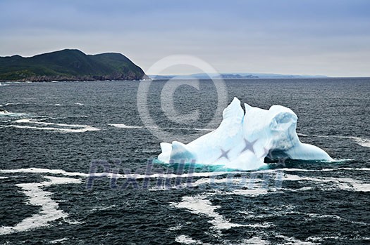 Melting iceberg off the coast of Newfoundland, Canada Melting iceberg off the coast of Newfoundland, Canada