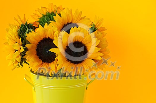 Bouquet of sunflowers in yellow metal vase Bouquet of sunflowers in yellow metal vase