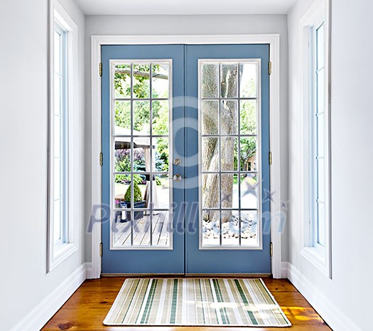 Double patio french doors with windows exiting to sunny backyard Double patio french doors with windows exiting to sunny backyard