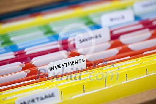 Open file folder drawer with many multicolored files containing personal finance documents Open file folder drawer with many multicolored files containing personal finance documents