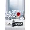 Reserved romantic table setting with roses plates and cutlery