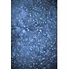 Background of snow flurry falling at night with motion blur
