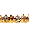 Golden Christmas decorations with gold balls and ornaments on white background