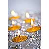 Burning golden decorative Christmas candles with glass beads