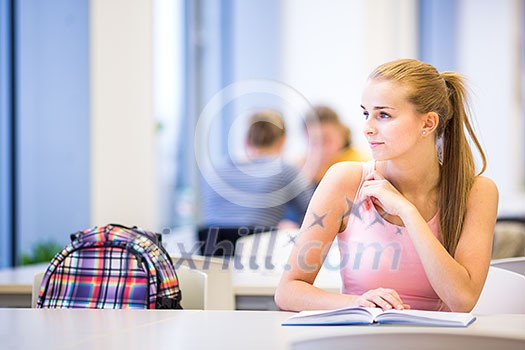 Pretty, female college student in a library, looking for a book (shallow DOF; color toned image) Pretty, female college student in a library, looking for a book (shallow DOF; color toned image)