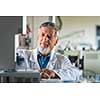 Senior chemistry professor/doctor in a lab (color toned image)