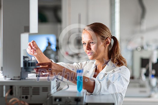 Portrait of a female researcher doing research in a chemistry lab (shallow DOF; color toned image) Portrait of a female researcher doing research in a chemistry lab (shallow DOF; color toned image)