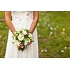 Lovely wedding bouquet in bride's hands