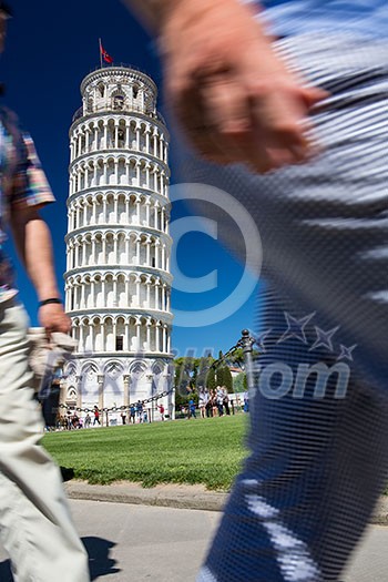 Crowds of tourists visiting the Leaning Tower of Pisa, Tuscany, Italy (motion blur technique used to convey the incessant influx of tourist to this landmark)