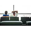 Senior couple waiting for their flight in an airport (shallow DOF; color toned image)