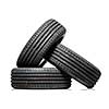 Stack of brand new high performance car tires on clean high-key white studio background