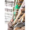 Man choosing and buying construction wood in a DIY store for his DIY home re-modeling project