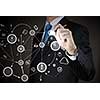 Chest view of businessman drawing connection lines on screen