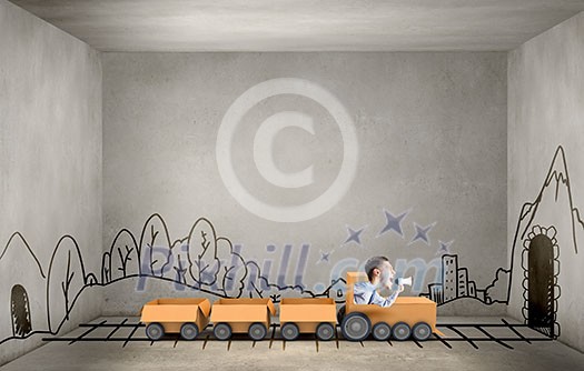 Funny image of businessman riding in carton train Funny image of businessman riding in carton train