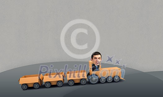Funny image of businessman riding in carton train Funny image of businessman riding in carton train