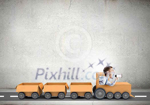 Funny image of businessman riding in carton train Funny image of businessman riding in carton train