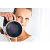 Pretty, female photographer with digital camera - DSLR and a huge telephoto lens (color toned image; shallow DOF)