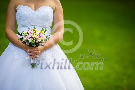 Lovely wedding bouquet in bride's hands Lovely wedding bouquet in bride's hands